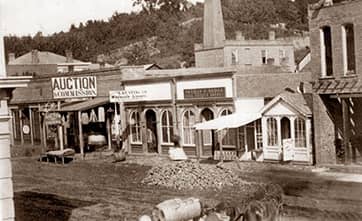 Agent next to sold sign